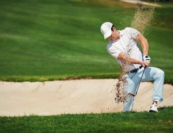 Guy Hitting Golf Ball